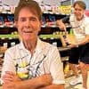 Sir Cliff Richard, 84, shows off his sweet side for 2026 calendar as he offers up biscuits and poses with wings for his highly anticipated annual photoshoot