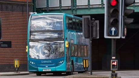 Child suffers head injury after falling from top window of double-decker bus