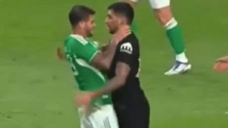 Bruno Guimaraes puts hands around Cristian Romero's THROAT as pair clash during friendly