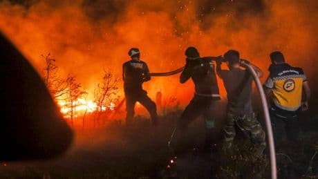 Syrian wildfires spread due to heavy winds and war remnants