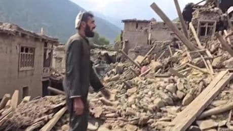 Afghanistan villagers dig through rubble with bare hands in desperate search for earthquake victims