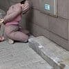 Moment female assassin shoots top anti-Russian activist in failed hit before she is bundled to the ground in Ukraine