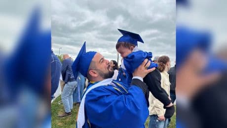 You did it, baby: New grad dad chased by cops after bringing infant son onstage