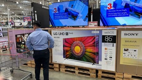 Key inflation gauge rose last month while Americans cut back on spending