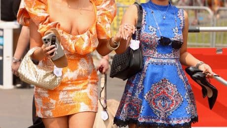 Glamorous racegoers make the most of the hot weather in colourful mini dresses and eye-catching hats at York races