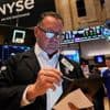 Asian shares trade higher after Wall Street climbs moderately as Fed holds rates steady