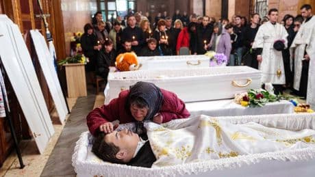 AP PHOTOS: Three Ukrainian Siblings Buried in Aftermath of Russian Missile Strike