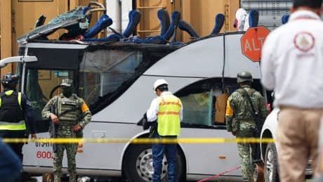 Freight train slams into a bus outside Mexico City and kills at least 8 people