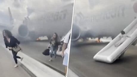 Angstig moment: passagiers verlaten rokend vliegtuig via noodglijbaan