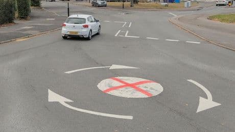 Painted St George's Cross on mini-roundabouts sparks debate among residents