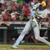Yelich hits 2 HRs as MLB-best Brewers rally past Reds 10-8, tie club record with 13th straight win