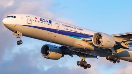 Passenger restrained after trying to open plane exit door mid-flight