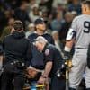 Grisham hits 2 homers to lead Yankees past Mariners 11-5, New York's Cabrera leaves in ambulance
