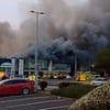 Three people are arrested after huge inferno rips through Dunelm and Pets At Home stores