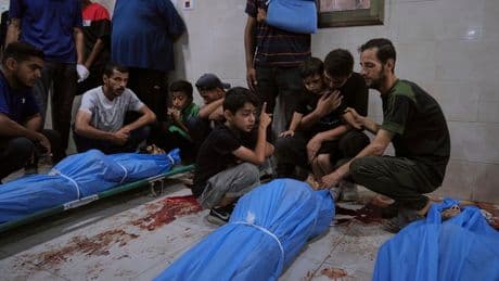Photos show Palestinians mourning after people were killed in Israeli strikes