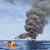 Pregnant woman is among at least five dead after ferry carrying hundreds of people bursts into flames in Indonesia - with frantic families seen leaping into the sea to escape