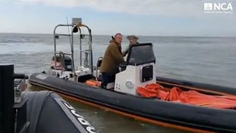 Moment drug-smuggling pals DIVE into water during boat chase as they attempt to flee Border Force with cocaine in hull