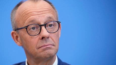 German leader Merz says his government has a 'stable foundation' despite a dispute