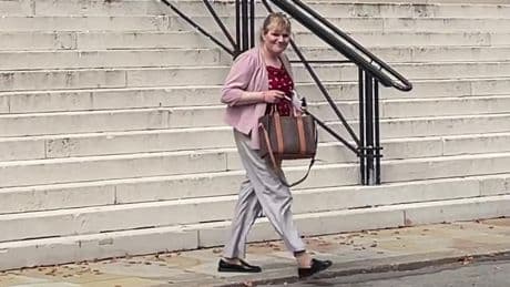 Former Conservative MP appears in court accused of having false passport