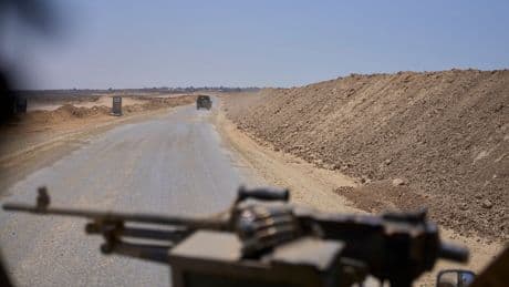 Israel insists on keeping troops in Gaza. That complicates truce talks with Hamas