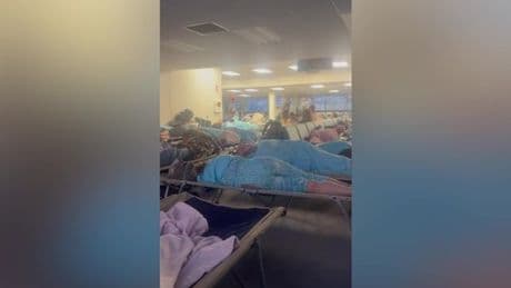 Brits stranded in 'war-zone' conditions as plane diverts mid-flight due to 'smoking'