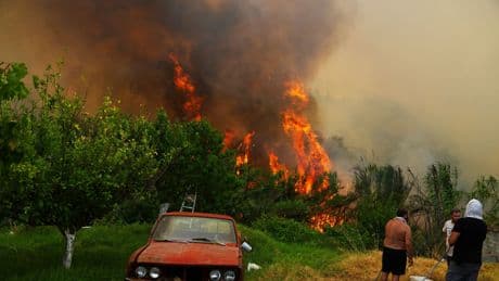 European wildfires kill at least three as British bar worker joins emergency efforts on Greek island