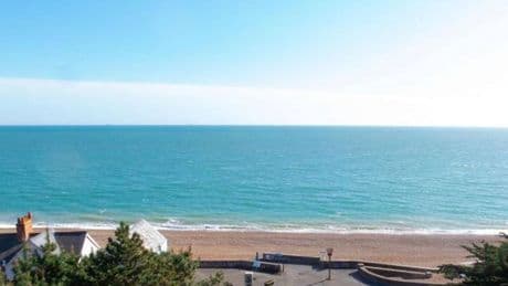 Seaside village with rainbow homes and sandy beach is 'UK's Riviera'