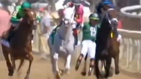 Champion jockey knocked onto rival horse before hitting the deck in wild moment after start