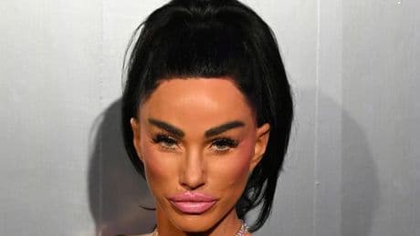 Katie Price dazzles in huge customised hat as she thrills fans at drag show