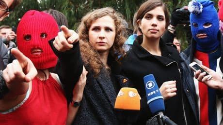 Russian court sentences Pussy Riot members in absentia to jail for anti-war performances