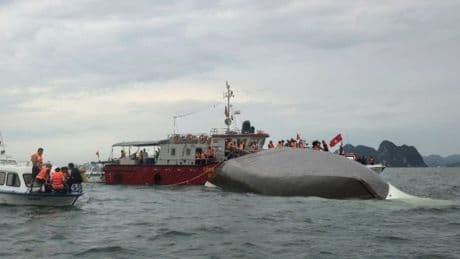 Tourist boat capsizes leaving at least three dead and 38 still missing