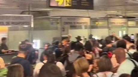 Brits caught in 'inhumane' airport chaos as passengers fight and vomit in crush