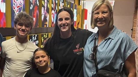 Caitlin Clark puts on a brave face for photo with golf icon... despite missing a worrying 12th straight Indiana Fever game
