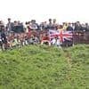 Daredevils hurl themselves down Cooper's Hill as Gloucestershire's famous Cheese Rolling race returns