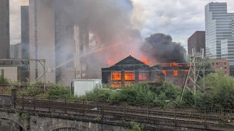 Huge fire breaks out in Manchester with people evacuated and train lines blocked
