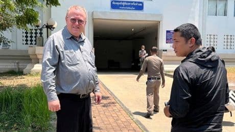 US scholar leaves Thailand after charges of insulting monarchy are dropped
