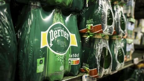 An inquiry says France's government covered up Nestle's illegal treatment of bottled water