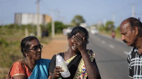 A wartime mass grave in Sri Lanka yields a baby bottle, children's clothes and 141 skeletons
