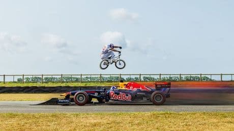 Daredevil Scots mountainbiker jumps over oncoming Formula One car in 'scariest' feat