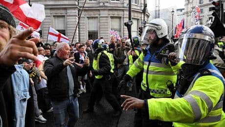 Dozens of police officers injured and 24 arrests as huge Tommy Robinson rally marred by violence