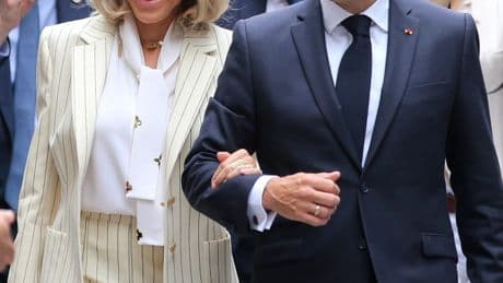 Emmanuel Macron & wife Brigitte put on united front for cameras day after shocking face slap drama