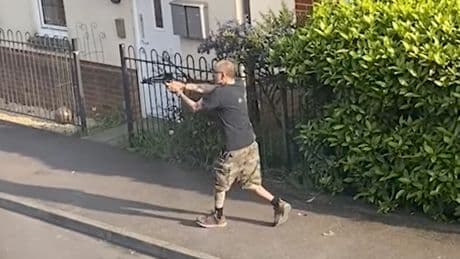 Man fires crossbow at police officer after stabbing neighbour