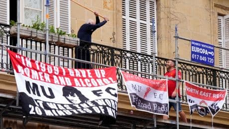 Watch fuming Bilbao local swing at rowdy Man Utd fan with huge stick after Devils die hards plaster balcony with flags
