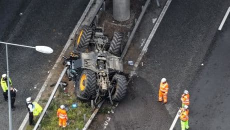 M20 closed after tractor flips and falls off bridge onto busy motorway below