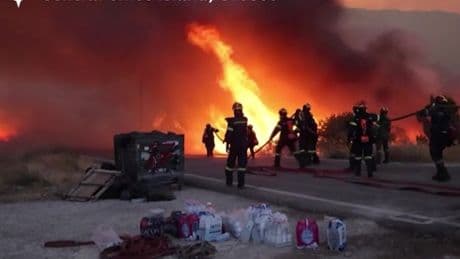 Wildfires ravage Greek holiday island as fire crews battle blazes and dozens evacuated