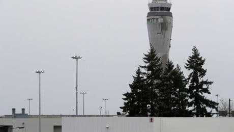 Police search for fugitive who escaped from Seattle's airport in handcuffs