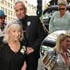 Fat Tony's wedding kicks off in style as DJ, 58, arrives flanked by longtime pal Boy George for his London nuptials before exchanging vows with Stavros Agapiou, 32