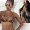Mel B, 49, shows off her ageless physique in a signature leopard print bikini as she shares then and now snaps amid claims of Spice Girls reunion tour