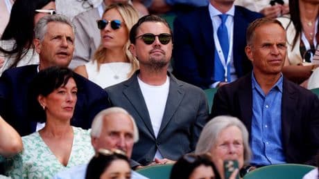 Leonardo DiCaprio laughs with Wimbledon spectators in Royal Box