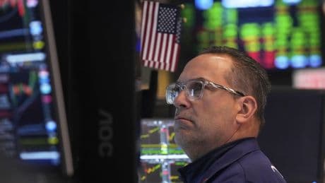 Wall Street climbs in choppy trading after Fed warns of rising risks for economy, holds rates steady